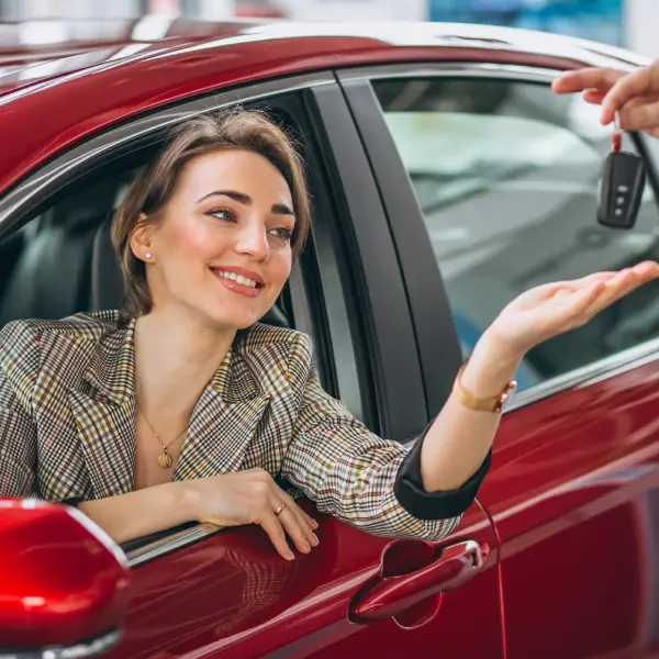 woman-sitting-red-car-receiving-keys woman-sitting-red-car-receiving-keys